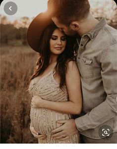 a pregnant woman in a sequin dress standing next to a man wearing a cowboy hat