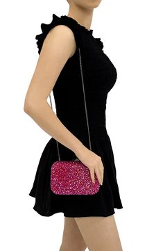 This crystal-covered clutch with a rectangular silhouette is topped with a removable crossbody chain for versatile styling. Twill lining Polyurethane/glass Imported Pink Rectangular Clutch With Chain Strap, Chic Rhinestone Clutch For Cocktail, Pink Rectangular Evening Bag For Night Out, Chic Rhinestone Cocktail Clutch, Pink Rectangular Clutch With Rhinestones, Chic Rhinestone Evening Bag For Cocktail, Pink Clutch With Chain Strap, Pink Evening Bag With Chain Strap, Pink Evening Bag With Chain Strap For Events