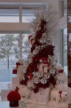 a christmas tree decorated with red and silver ornaments