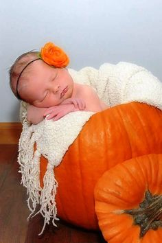 a baby is sleeping on top of a giant pumpkin with the words, buonomatte above it