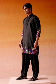 Black silk kurta with figurine motifs, highlighted with bead embroidery on the hem and sleeves. Paired with a pant. - Aza Fashions Traditional Sets With Embroidered Sleeves For Festivals, Traditional Festival Sets With Embroidered Sleeves, Festive Straight Kurta Salwar Kameez With Embroidered Sleeves, Traditional Salwar Kameez With Embroidered Sleeves, Salwar Kameez With Embroidered Sleeves For Festivals, Unstitched Kurta With Embroidered Sleeves For Navratri, Traditional Embroidered Kurta For Navratri, Traditional Navratri Kurta With Embroidered Sleeves, Traditional Sets With Embroidered Sleeves For Transitional Season