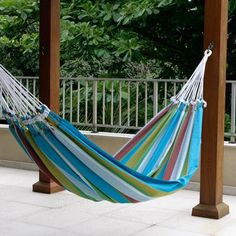 a colorful hammock hanging from a wooden structure