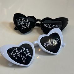 three heart shaped sunglasses with writing on them