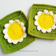 two crocheted coasters with white and yellow flowers