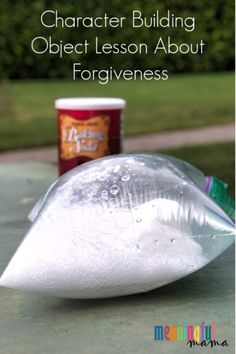 a plastic bag filled with white liquid next to a can of ice cream on top of a table