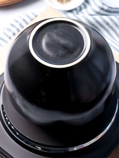 a close up of a black object on a table