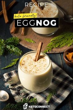 an eggnog drink in a glass with cinnamon sticks