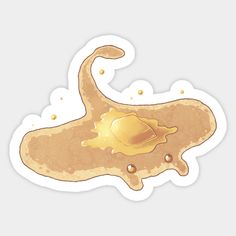 a piece of food that is shaped like an animal's stomach with gold paint on it