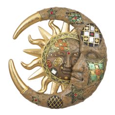 the sun and moon face is made out of brass, with different designs on it