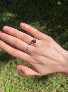 Faceted rhodolite garnet stone set in 999 fine silver and 925 sterling silver on a patterned band. US Ring Size 6.