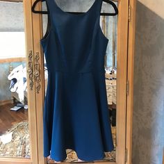 Beautiful Flowy Dress Fits Above The Knee With Zipper Back Size Small Blue Dresses With Back Zipper For Date Night, Blue Dress With Back Zipper For Date Night, Blue A-line Midi Dress With Flattering Silhouette, Blue A-line Midi Dress For Bridesmaids, Blue Cocktail Dress With Back Zipper, Flowy Dress, Above The Knee, Blue Dress, The Knee