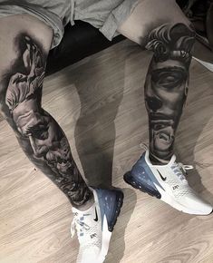 a man's legs with tattoos on them