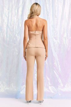 Elevate your wardrobe with our Beige Tailored Tube Top and Pants Set! This versatile set features a woven tube top and matching pants for a sleek and stylish look. Perfect for any occasion, this set will effortlessly take you from day to night. Say goodbye to boring outfits and hello to effortless elegance. PRE-ORDER 07/22/24 Fabric & fit: 100% polyester Lining 97%polyester 3%spandex Model is wearing size small. Chic Two-piece Set Bottoms For Workwear, Chic Two-piece Pants Set For Work, Chic Strapless Jumpsuit For Summer, Chic Strapless Elastane Jumpsuit For Summer, Chic Summer Strapless Elastane Jumpsuit, Chic Strapless Elastane Jumpsuit For Night Out, Elegant Two-piece Pants Set, Chic Stretch Sets With Long Pants, Chic Two-piece Pant Set For Party