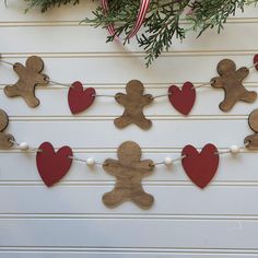 gingerbread man and heart garland hanging on the wall