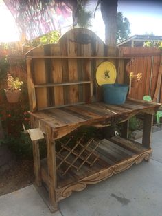 a potting bench made out of wooden pallets