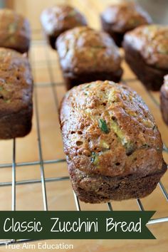 muffins cooling on a rack with the words classic zucchini bread