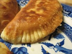 two pastries on a blue and white plate