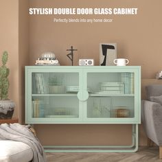 a green cabinet with glass doors in a living room