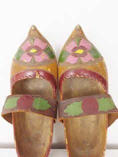 Vintage Folk Art Shoes Vintage Clogs Wooden Clogs Carved Floral Folk Art Rustic Decor Primitive Decor Cottage Chic Decor Farmhouse DecorAntique folk art carved floral clogs made of wood and leather from France or perhaps the Netherlands.  I believe they are part of a traditional costume for folk dancing and the like.  Being antique, these are best for display.About 10.25" long, 3.5" wide, 2.5" high Traditional Brown Slip-on Clogs, Traditional Closed Toe Mules For Festivals, Handmade Traditional Closed Toe Clogs, Traditional Handmade Clogs With Round Toe, Traditional Handmade Closed Toe Clogs, Traditional Closed Toe Clogs, Traditional Slip-on Clogs With Rubber Sole, Traditional Pointed Toe Mules, Floral Folk Art