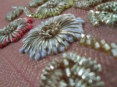 several pieces of jewelry are laying on a table