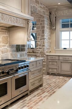 a kitchen with an oven, stove and counter tops in it's center island