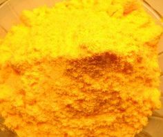 yellow powder in a glass bowl on a table