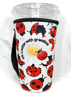 a cup sleeve with ladybugs on it