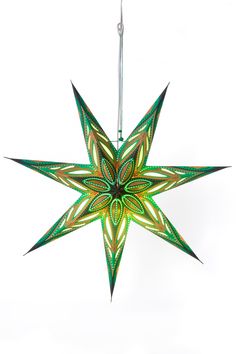 a green and yellow star hanging from the ceiling