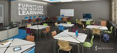 an empty classroom with desks and chairs in front of a chalkboard that says furniture for inspired learning