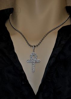 Embrace the symbolism of eternal life with our Egyptian Ankh Cross Pendant Necklace. This stunning pendant features the Ankh cross, beautifully adorned with sparkling stones, representing life and spirituality. Pendant Material: 925 Sterling Silver Chain Material: Stainless Steel Design: Egyptian Ankh cross with sparkling stones Features: Hypoallergenic, suitable for sensitive skin Perfect For: Daily wear, spiritual gatherings, special occasions, or as a thoughtful gift for men and women This Eg Spiritual Pendant Cross Necklace, Spiritual Metal Cross Pendant Necklace, Spiritual Metal Pendant Cross Necklace, Spiritual Ankh Cross Necklace Gift, Symbolic Silver Cross Jewelry, Silver Cross Jewelry Symbolic Style, Silver Cross Jewelry With Symbolic Style, Spiritual Ankh Shaped Metal Jewelry, Symbolic Metal Cross Necklace