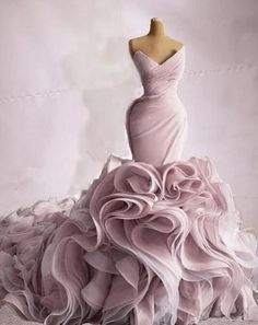 a dress on a mannequin with ruffled layers