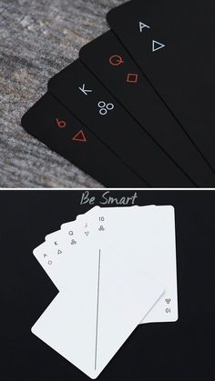 four playing cards with numbers and symbols on them, all in different shapes and sizes