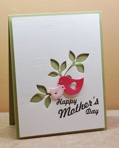 a mother's day card with a pink bird and green leaves on the front