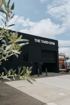 the yard gym is located in an industrial area with lots of greenery and blue skies