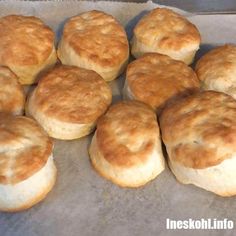 some biscuits are sitting on a baking sheet and ready to be baked in the oven