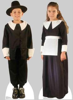 two children dressed in black and white clothing