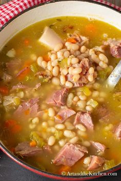 ham and bean soup in a pot with a ladle on the side, ready to be eaten