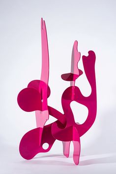 a pink sculpture sitting on top of a white table