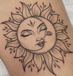 a sun tattoo on the back of a woman's thigh, with eyes closed