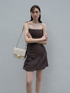 This product is made with at least 20% sustainable materials by weight. CHARLES & KEITH uses recycled, degradable, organic, and water-based materials in our eco-conscious collection. The Violetta boxy bag will become an instant favourite. The satchel-style front-flap bag features a distinctive buckle detail on the front, while its magnetic closure provides fuss-free access to your items. Opening up to a two-pocket interior, it will hold a lot and keep everything organised. With its clean beige finish and minimalist aesthetic, the Violetta has all the makings of a great everyday carrier. Chic Brown Square Bucket Bag, Brown Pouch Shoulder Bag For Day Out, Elegant Brown Bag For Day Out, Rectangular Brown Shoulder Bag For Day Out, Brown Rectangular Shoulder Bag For Day Out, Chic Brown Box Bag For Evening, Boxy Bags, Brand Collaboration, Charles Keith