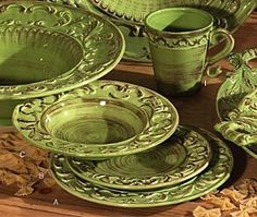 green dishes and cups on a wooden table