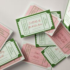 some pink and green tickets sitting on top of each other with the words, celebrate at it's birth