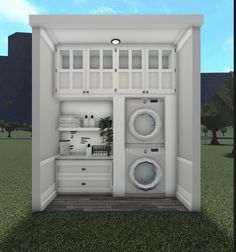 an open refrigerator with two washers and a dryer in the door on grass