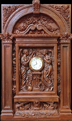 a wooden clock with carvings on the sides