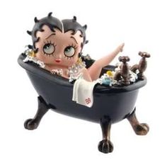 a figurine is sitting in a bathtub filled with toys