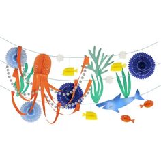 an octopus and other sea creatures hanging from clothes pins on a line with fish, corals, and bubbles