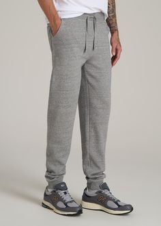 Relax In Style The Ultimate Extra-Long Men's Joggers Ready to meet your new favorite joggers? Our Wearever 2.0 Fleece Tall Men's Joggers are here to revolutionize your chill time. Designed for men over 6', these aren't just any joggers—they're your go-to for year-round comfort. Made from cozy fleece with a stretch fabric that moves with you, they offer a modern fit that's just right, not too tight. The updated trim, stylish drawstring, and thoughtful branding elevate these from basic to essentia Sports Joggers With Ribbed Cuffs And Tapered Leg, Sports Joggers With Tapered Leg And Ribbed Cuffs, Sporty Joggers With Ribbed Cuffs And Tapered Leg, Sporty Joggers With Tapered Leg And Ribbed Cuffs, Sports Sweatpants With Ribbed Cuffs And Tapered Leg, Winter Gym Joggers In Solid Color, Gray Sweats With Elastic Waistband For Jogging, Gray Leisure Joggers, Full Length Sports Joggers With Ribbed Waistband