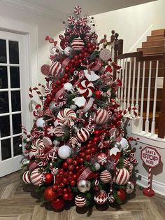 a christmas tree decorated with red and white ornaments