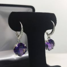 Gorgeous Amethyst & White Sapphire Sterling Silver Leverback Earrings * Cushion Cut Amethysts measure 10mm each * Brilliant Cut White Sapphire Accents * 9.1cts total Gemstone weight * Leverback Fasteners * Earrings Measure 1 & 1/4 inches Long Overall * Solid Sterling Silver Hallmarked & Gift Ready! Matching Ring can be found here https://www.etsy.com/listing/548736476/gorgeous-8ct-genuine-amethyst-ring-with Matching Pendant Necklace and Bracelet also Available! These Amethyst are Lab Round Purple Earrings With Gemstone Accents, Purple Gemstone Accented Round Earrings, Purple Gemstone Accent Round Earrings, Purple Round Earrings With Gemstone Accents, Fine Jewelry Amethyst Earrings With Prong Setting, White Gold Amethyst Earrings Fine Jewelry, White Gold Amethyst Earrings Jewelry Set, Brides Mom, Trending Jewelry