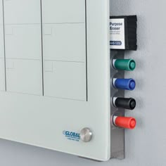 an electrical panel with four different colored wires